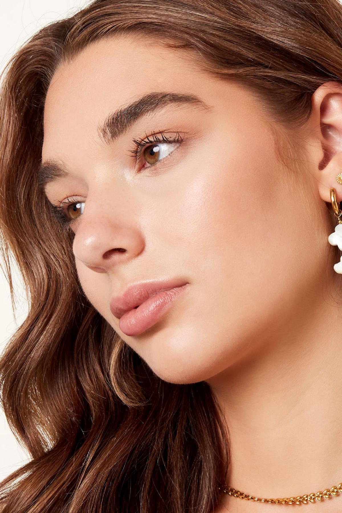 Ooorbellen met witte klavertjes