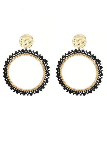 Goudkleurige oorbellen met zwarte miyuki beads
