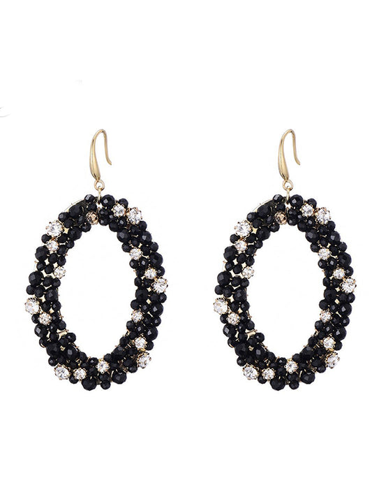 Goudkleurige oorbellen met glaskralen