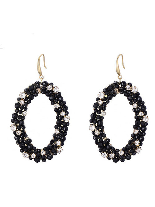 Goudkleurige oorbellen met glaskralen